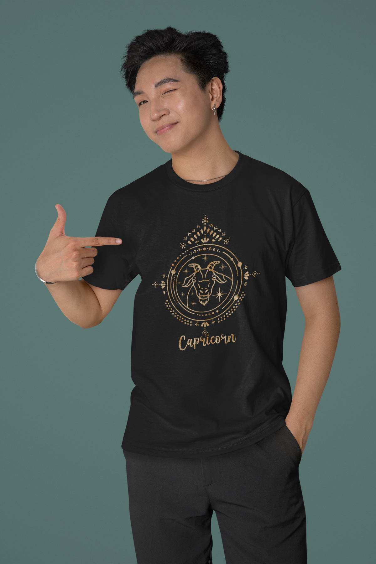 Capricorn tee laid flat on a plain background