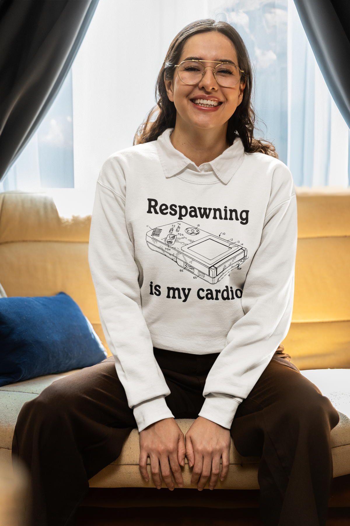 'Respawning is My Cardio' sweatshirt in white, woman wearing it seated, funny gift for gamers