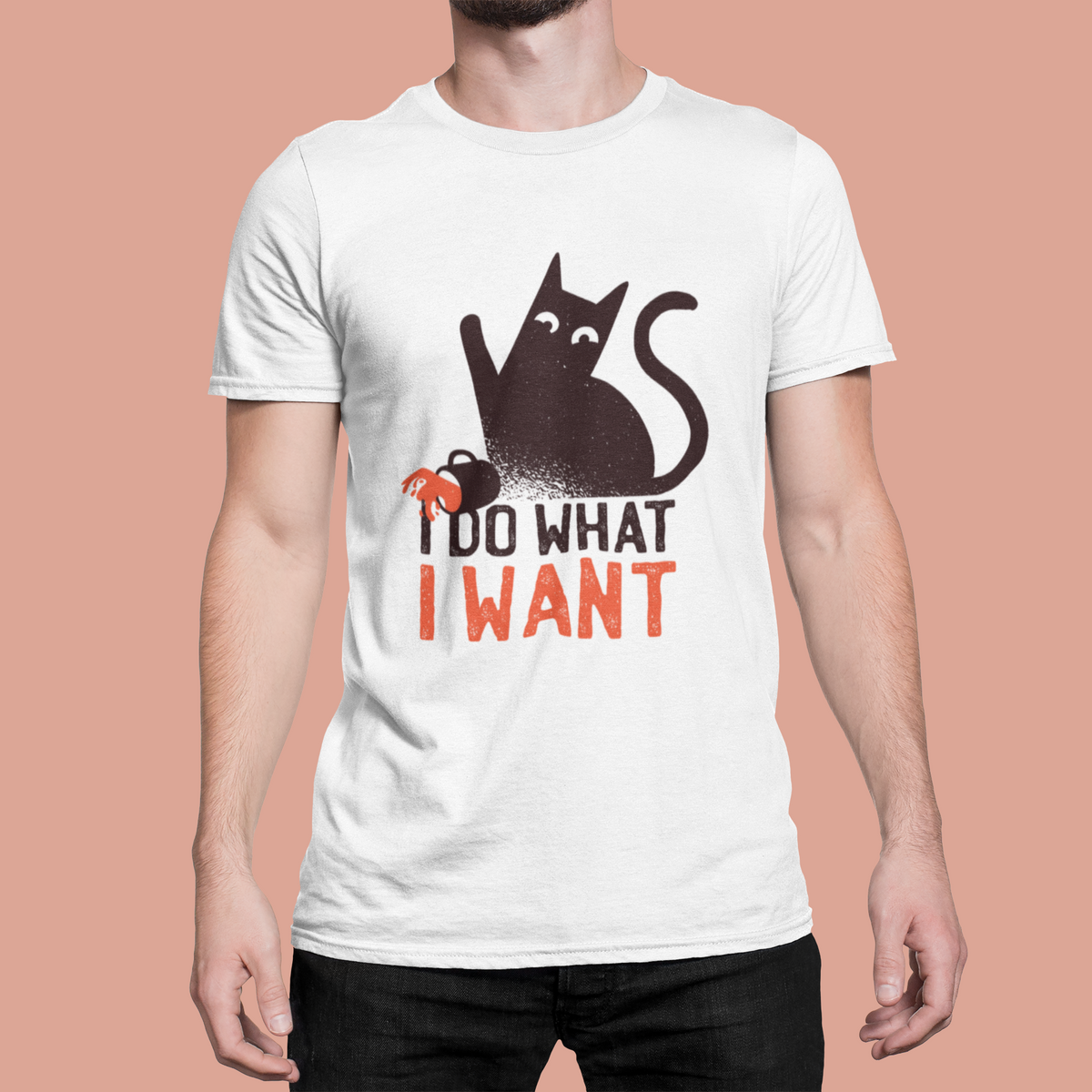 'I Do What I Want' cat t-shirt in white, man model wearing it against a peach background, funny sassy cat gift