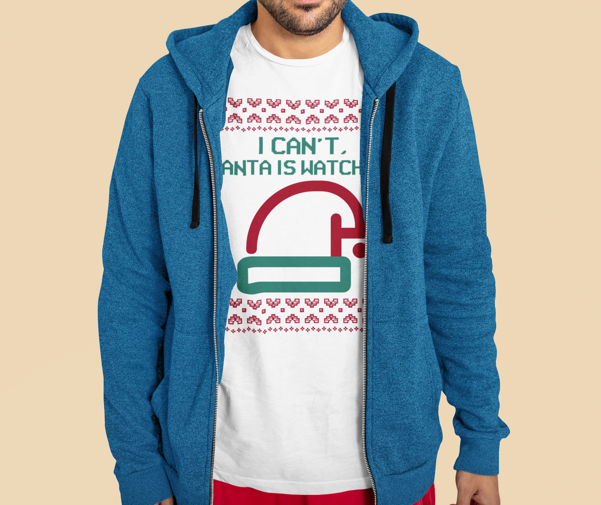 'I Can't Santa Is Watching' camera graphic t-shirt in white, man wearing it under blue zip hoodie, funny Christmas gift
