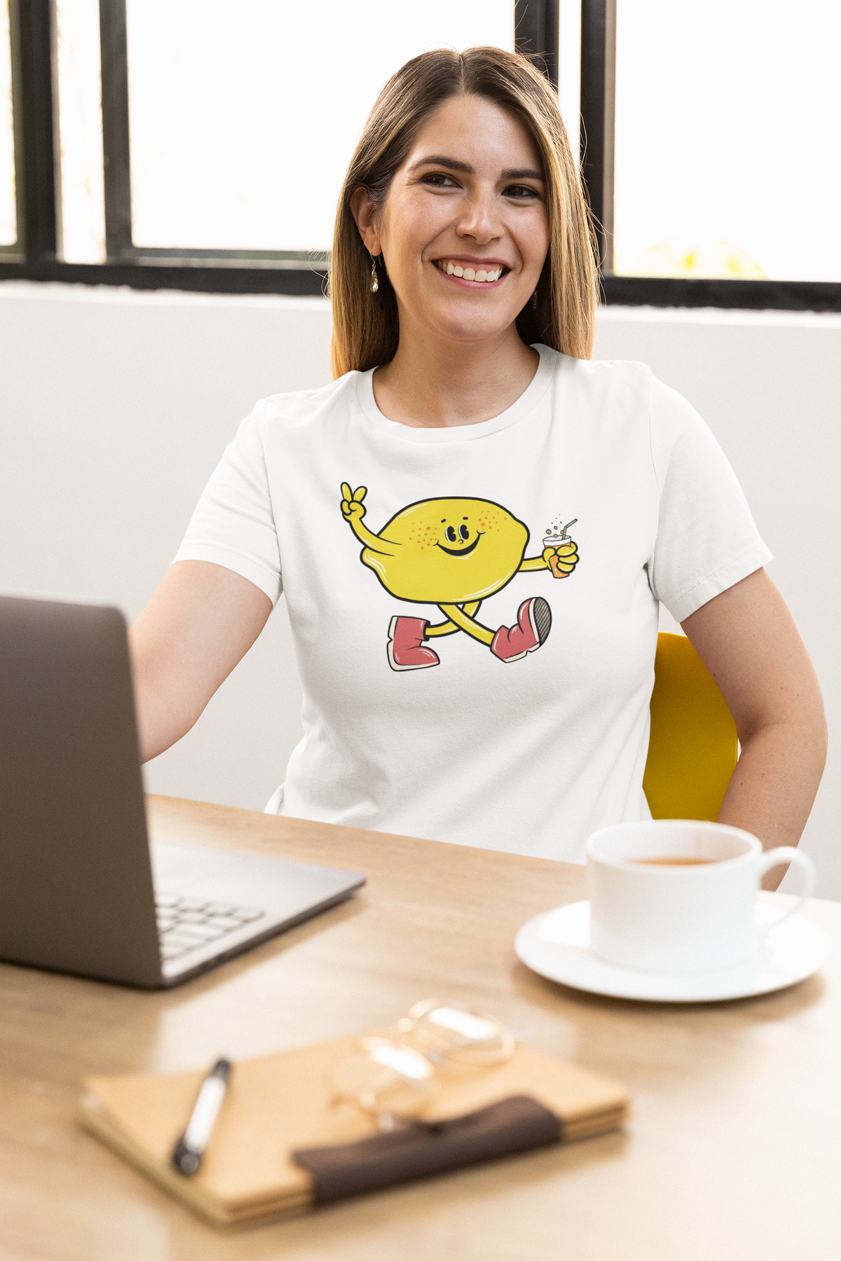 Cartoon lemon t-shirt in white, woman wearing it at a desk with laptop, funny summer foodie gift