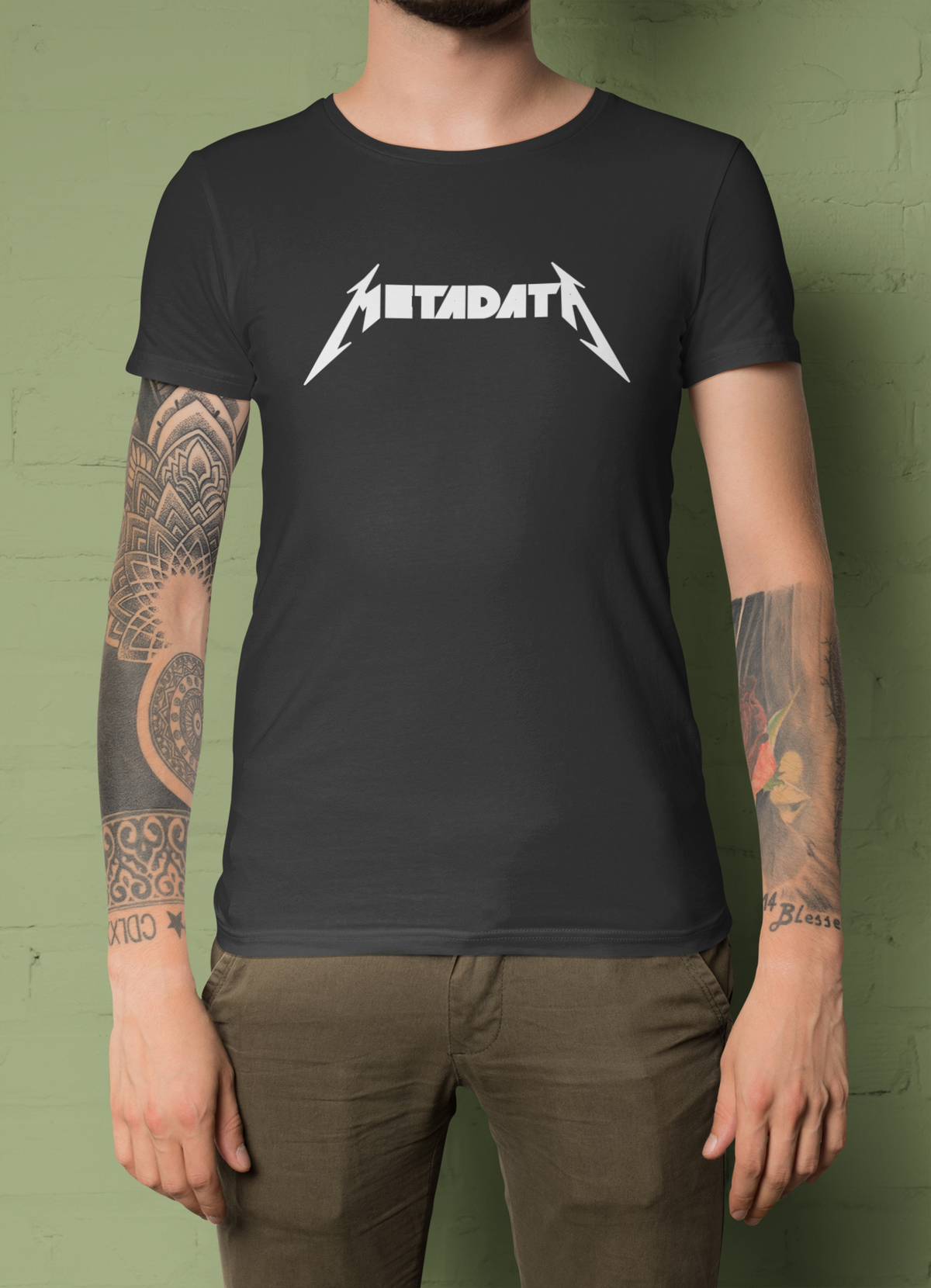 'Metadata' t-shirt in charcoal, tattooed man wearing it front view, funny data engineer t-shirt gift