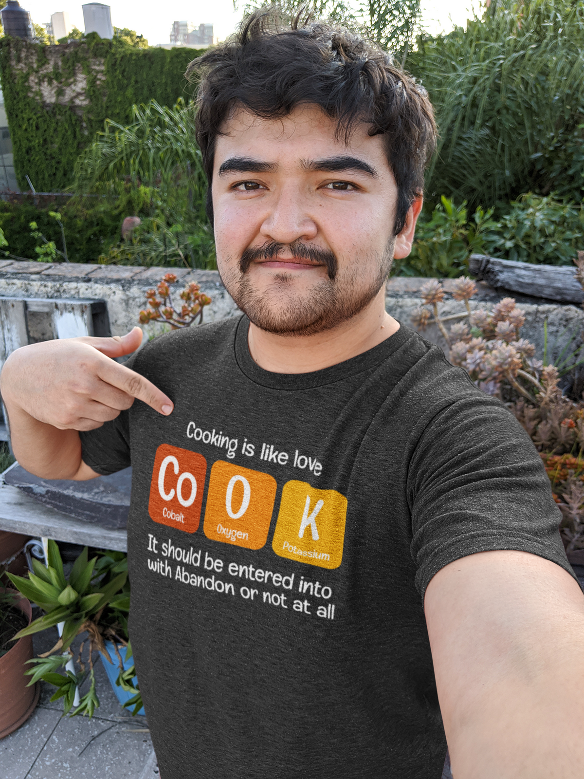 Co-O-K periodic table cook element pun graphic tee, flat lay with the graphic centered