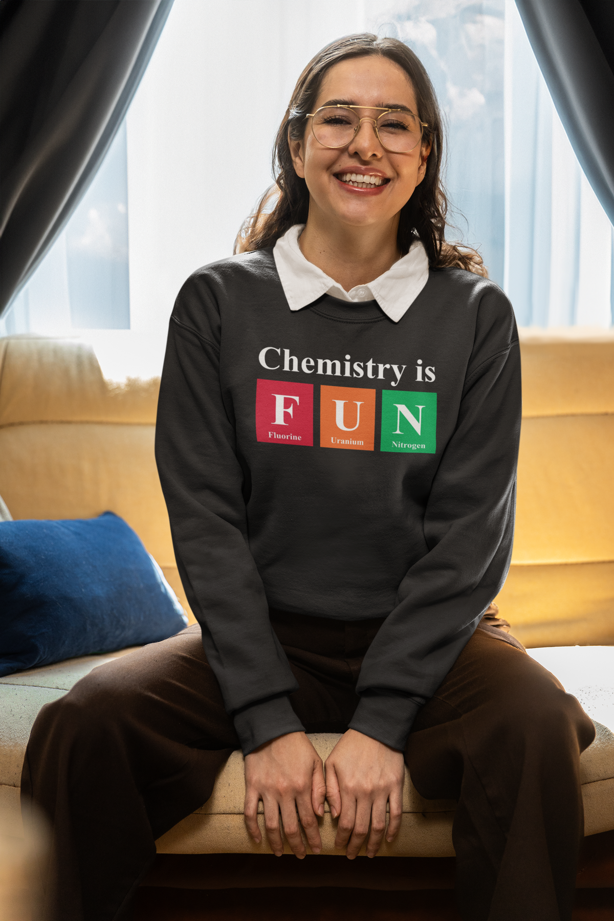 'Chemistry is FUN' crewneck sweatshirt in black, woman wearing it in studio, funny gift idea