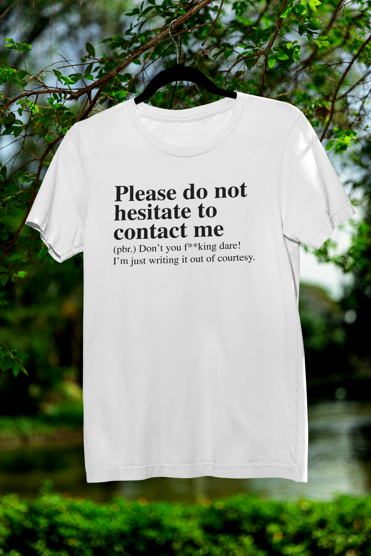 'Please Do Not Hesitate to Contact Me' T-shirt in white, hanging outdoors, sarcastic gift tee