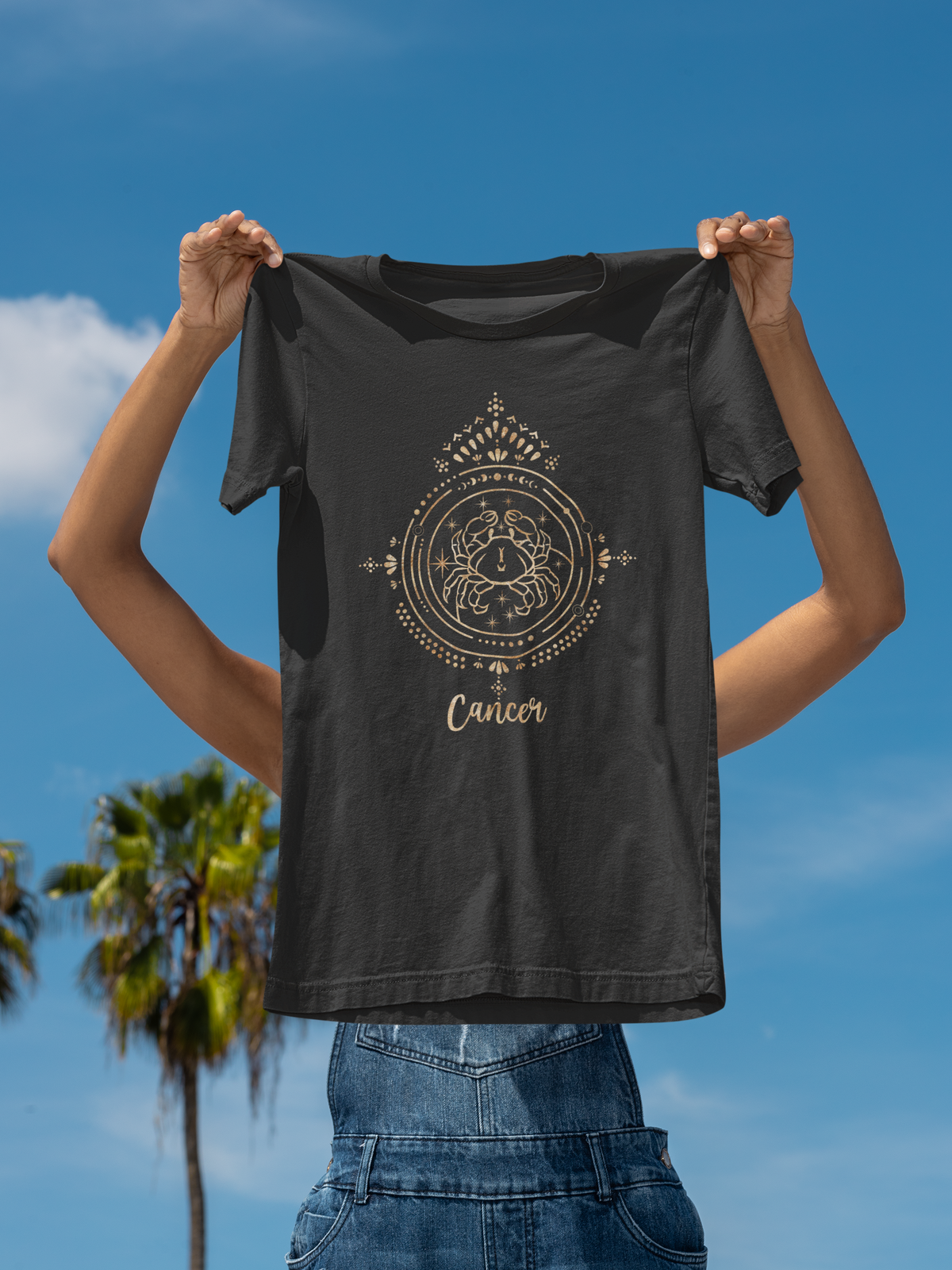 Cancer tee laid flat on a plain background