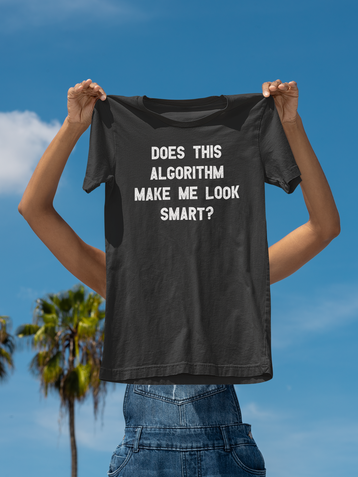 'Does This Algorithm Make Me Look Smart?' t-shirt in black, man holding it up outdoors, funny gift for coders