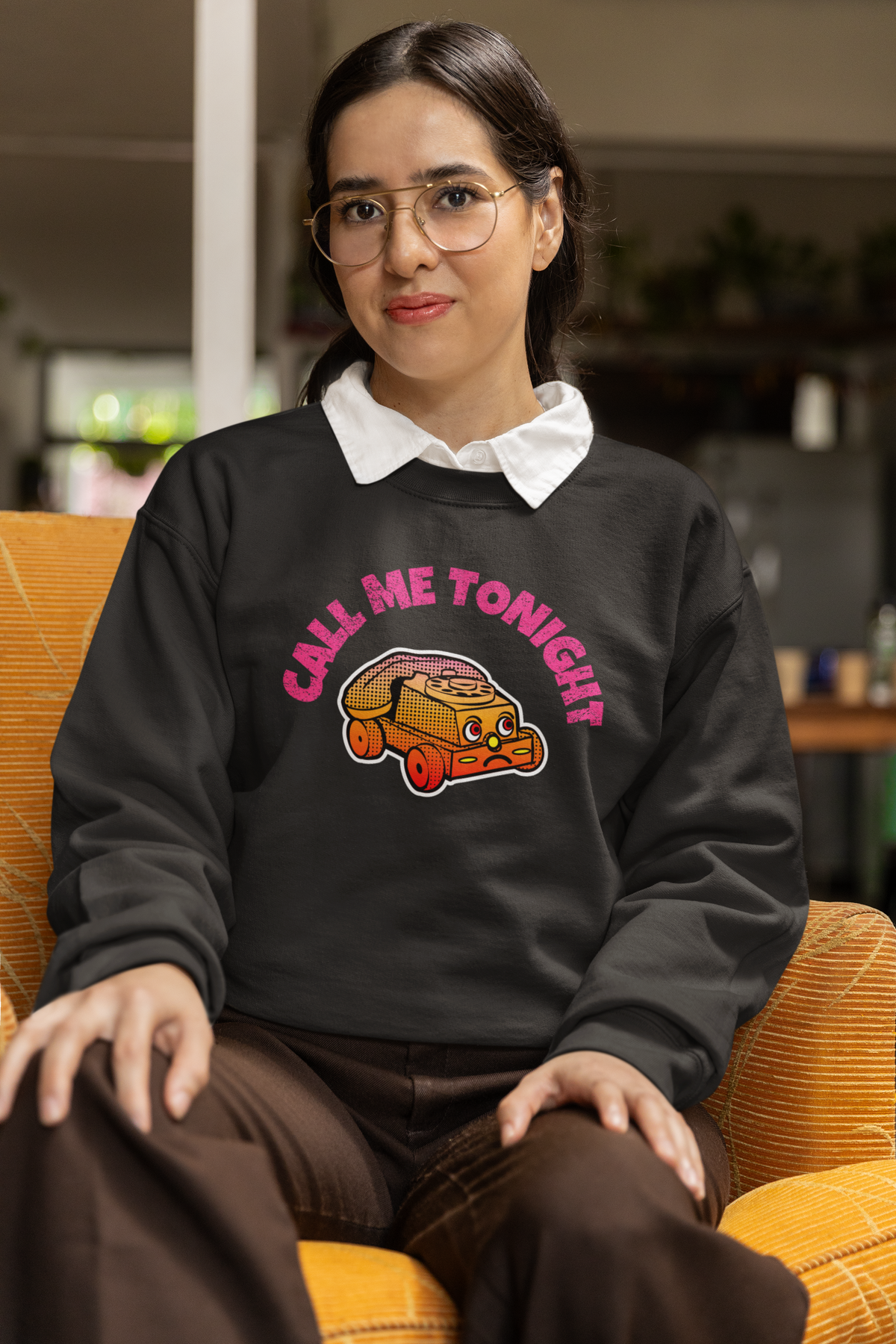 'Call Me Tonight' taco car graphic sweatshirt in charcoal, woman wearing it seated indoors, funny gift