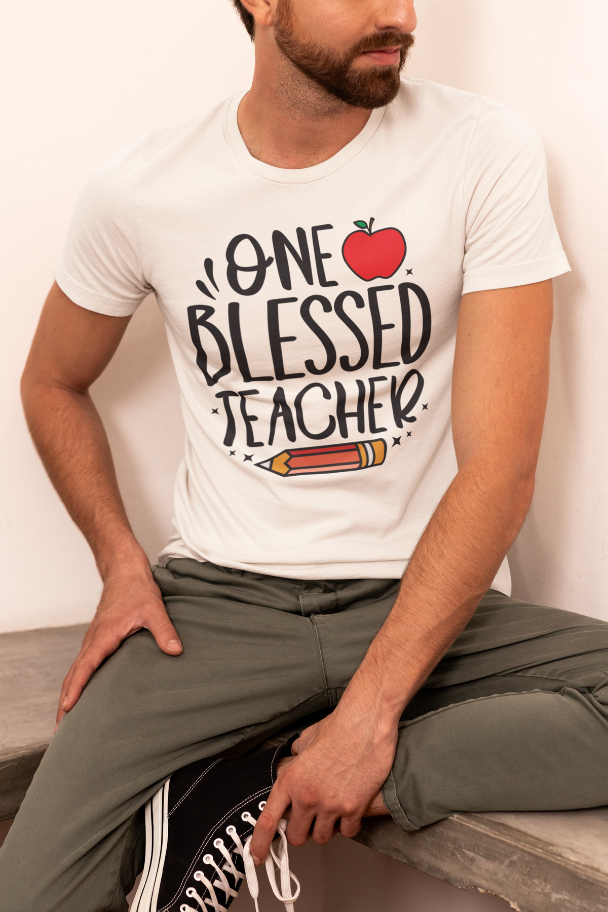'One Blessed Teacher' apple and pencil t-shirt in cream, man wearing it, funny gift for teachers