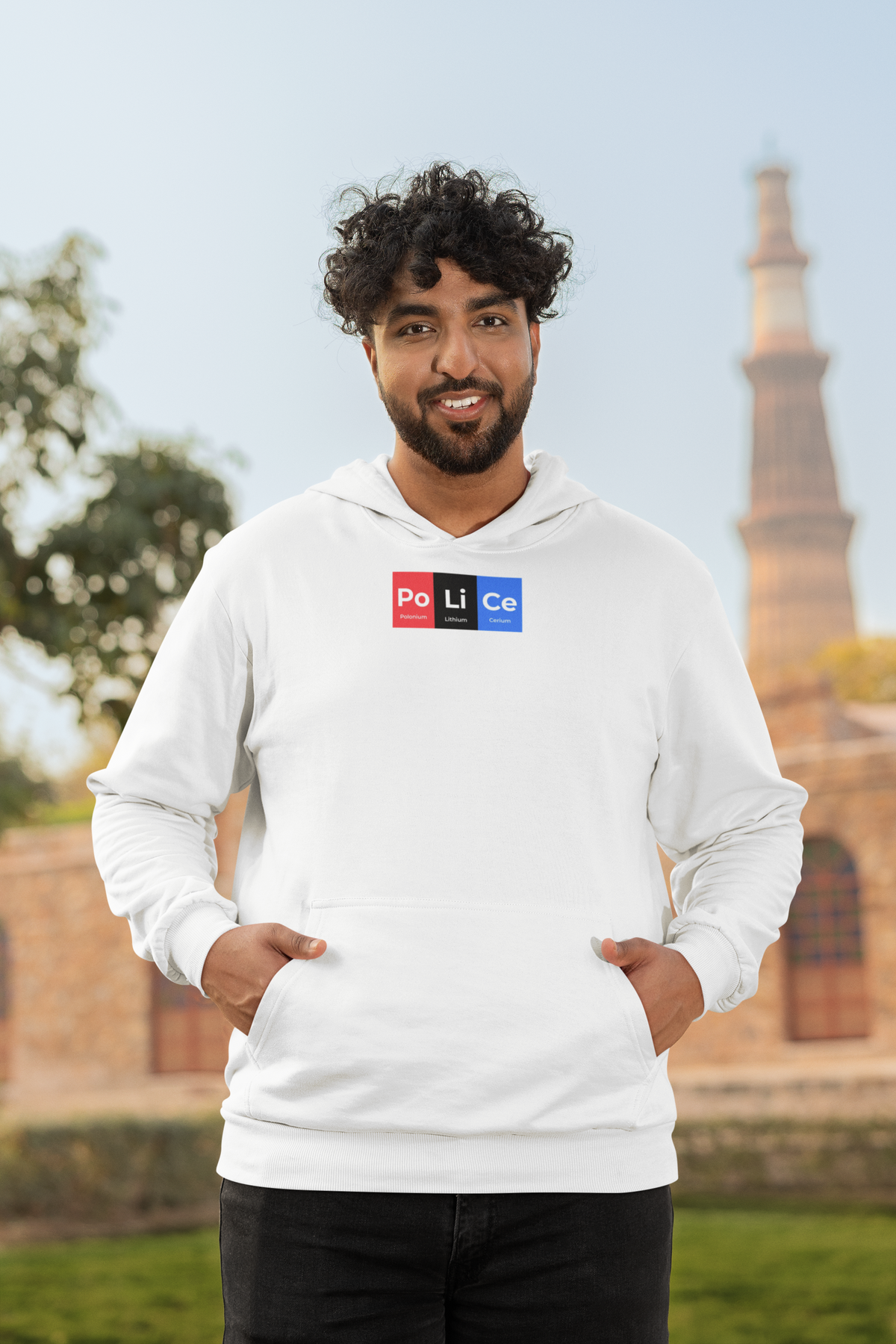 'Po-Li-Ce Periodic Table Hoodie' in white, man by a historic building, Hoodie mockup, Geekpsters