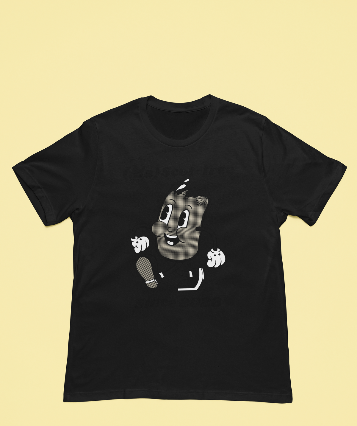 'Ma(scot)-free' milk carton t-shirt in black, flat lay on yellow background, funny pun gift shirt