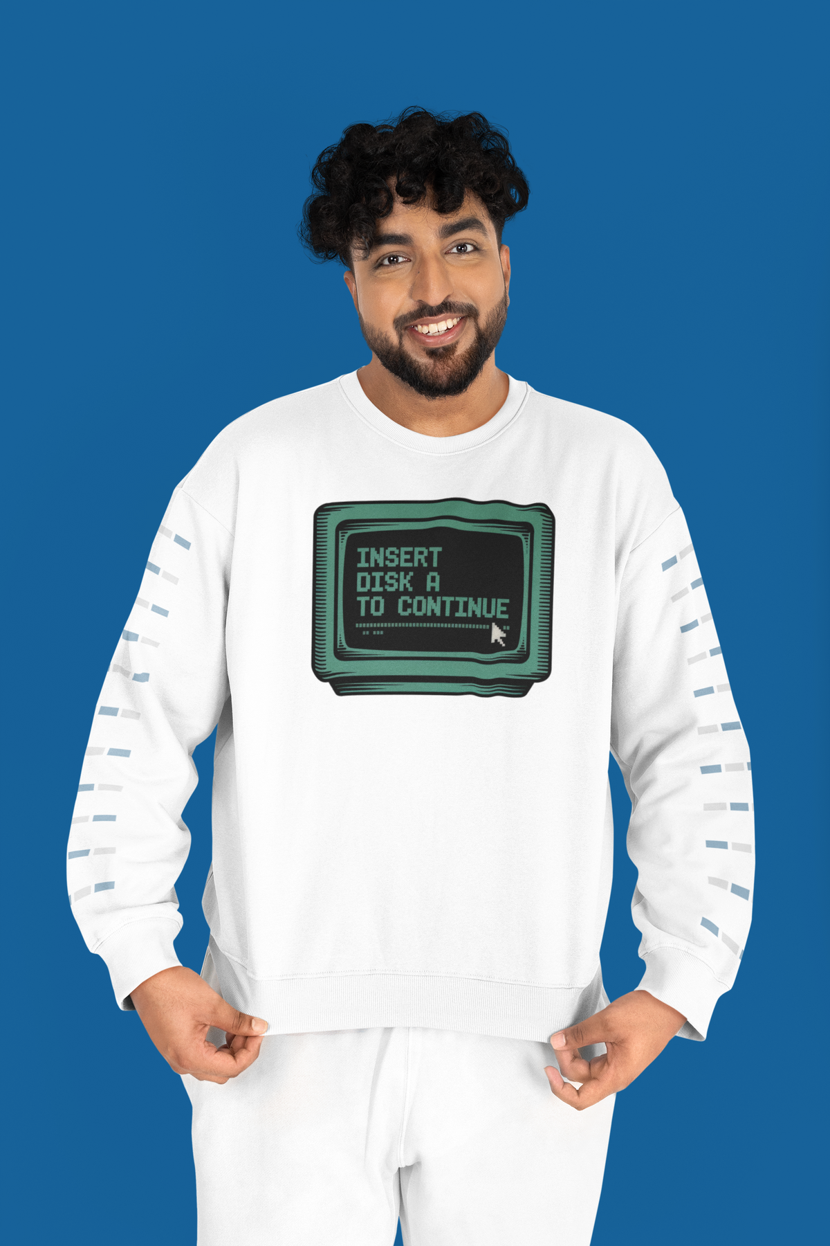 'Insert Disk A to Continue' sweatshirt in white, man wearing it on blue background, retro gamer nostalgia gift