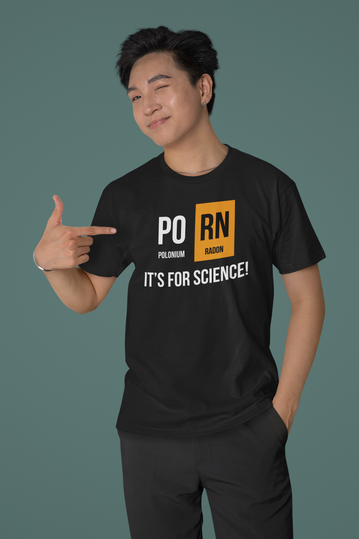 'PO-RN, It's for Science!' periodic table t-shirt in black, man pointing at the print, funny science pun tee