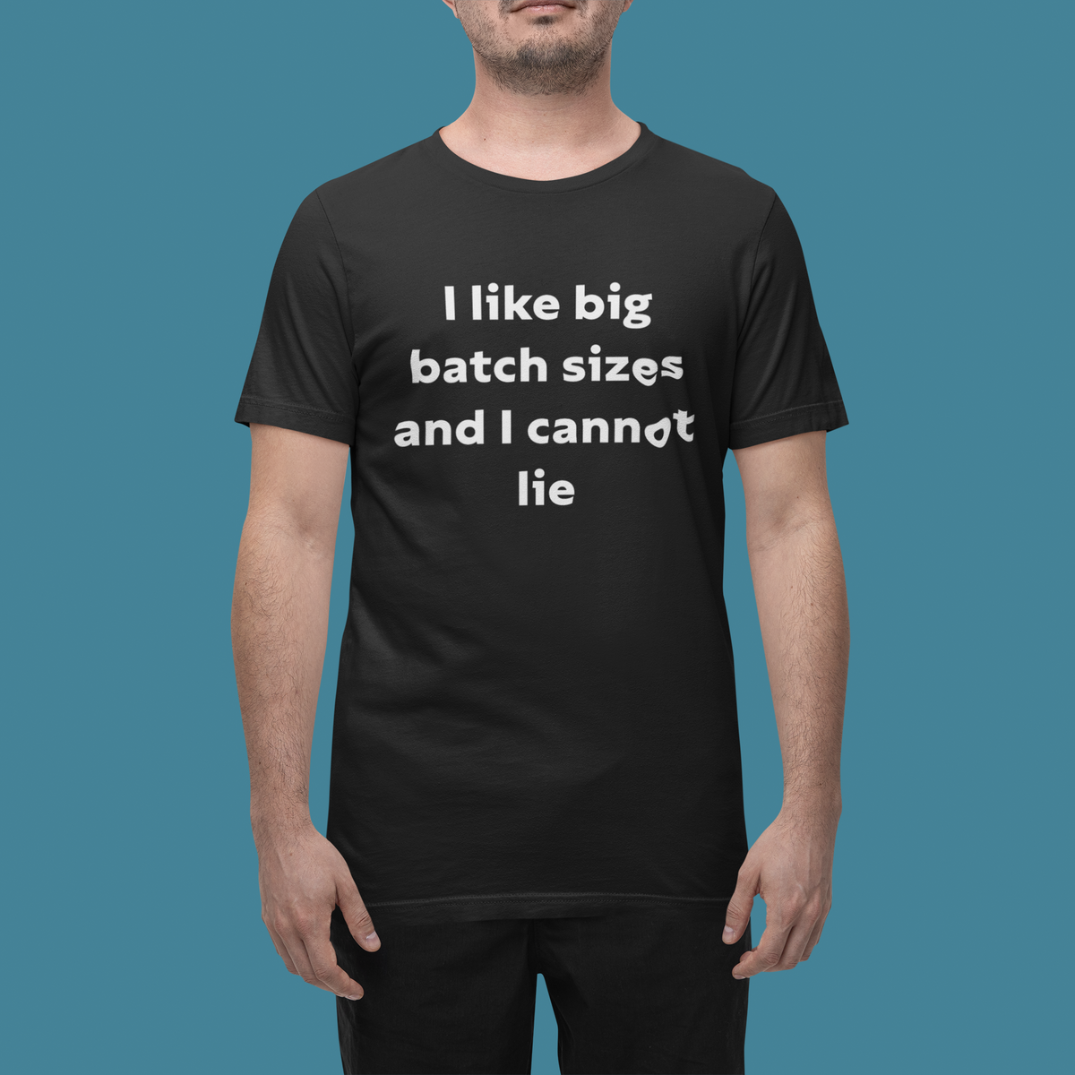 'I Like Big Batch Sizes and I Cannot Lie' t-shirt in black, man wearing it on blue background, funny coder gift