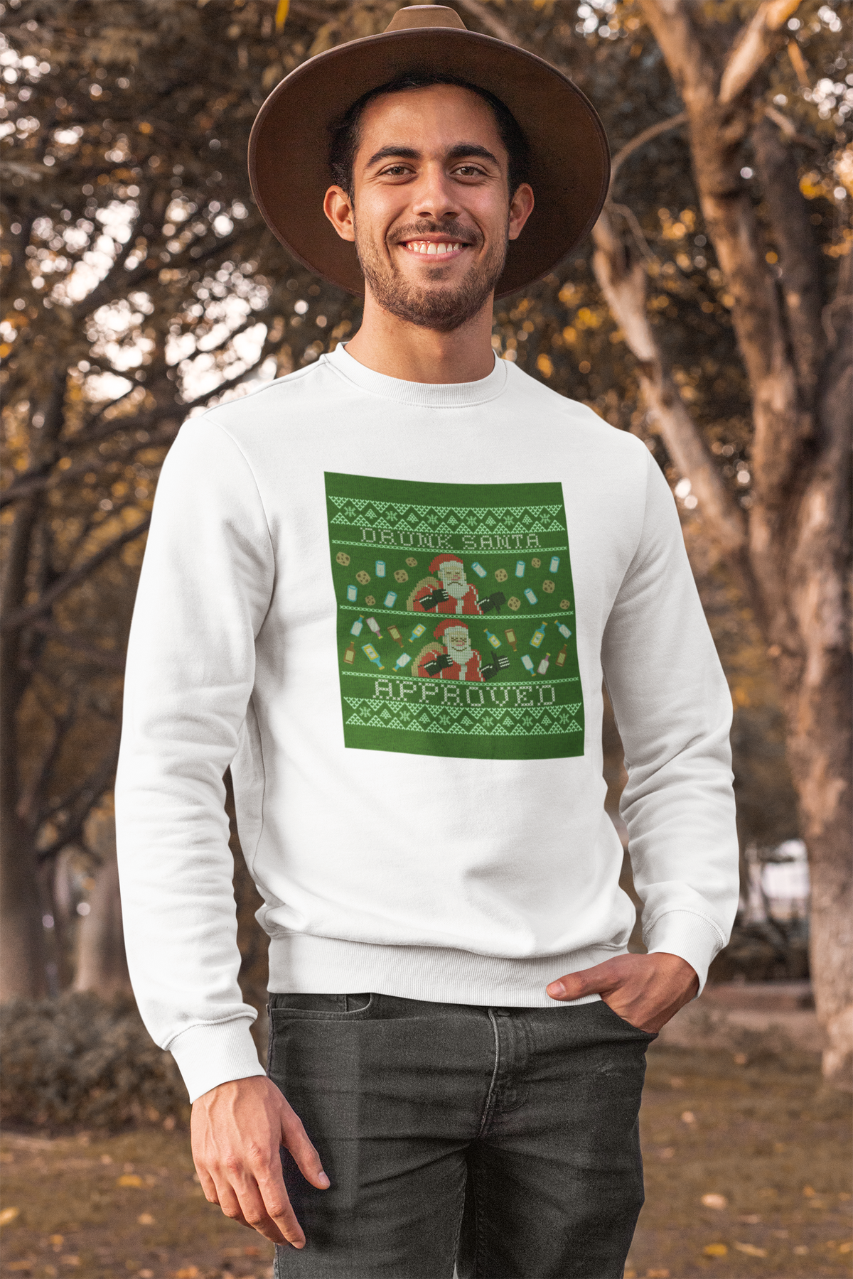 'Drunk Santa Approved' ugly christmas sweatshirt in white, man wearing it outdoors fall setting, gift