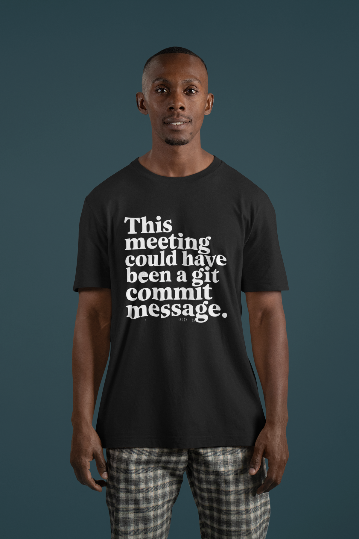 ‘This Meeting Could Have Been a Git Commit Message’ grey tee, man wearing it, dark background, developer gift