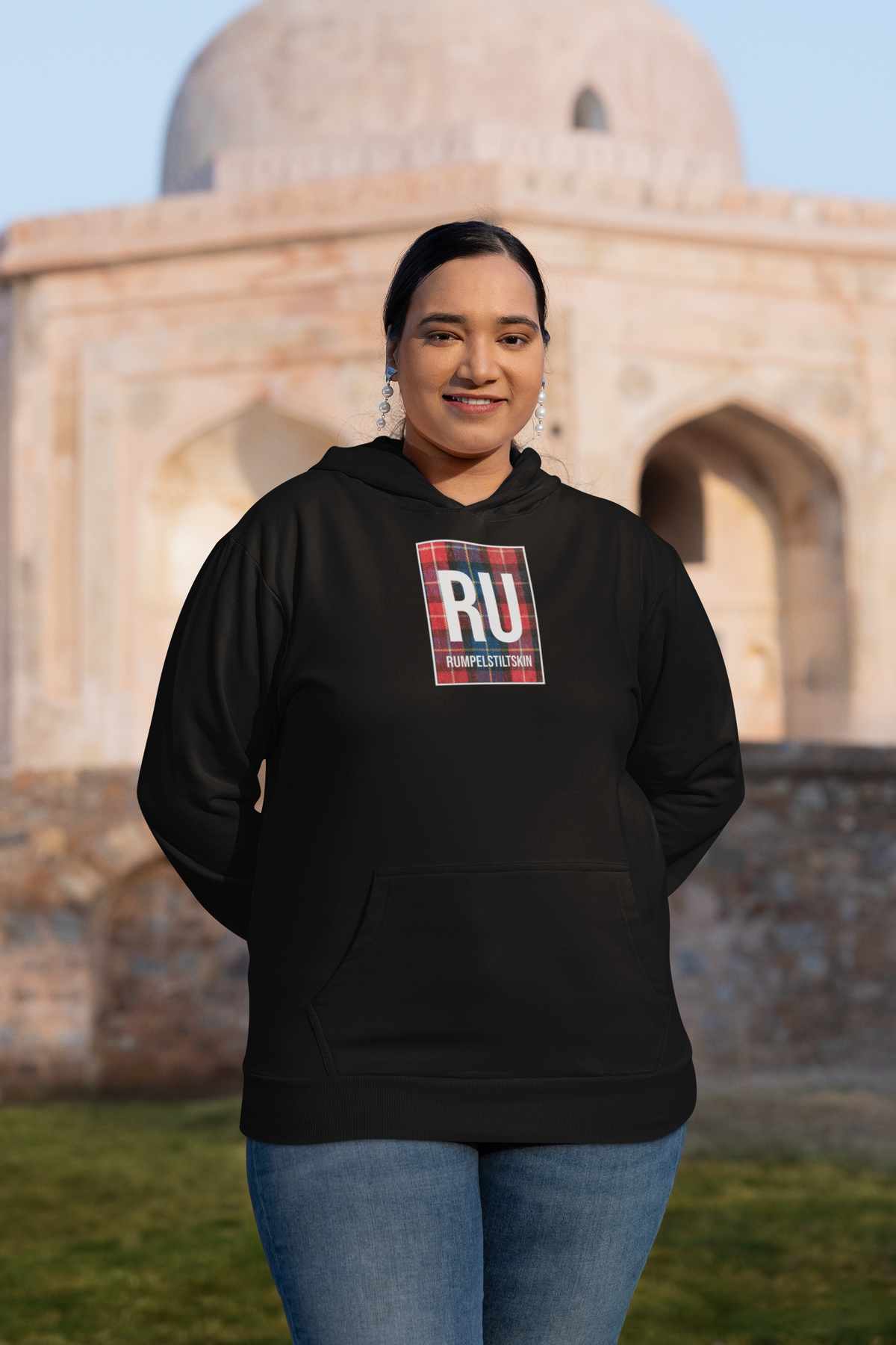 'RU Periodic Table Hoodie' in black, woman at a historic monument, Hoodie mockup, Geekpsters