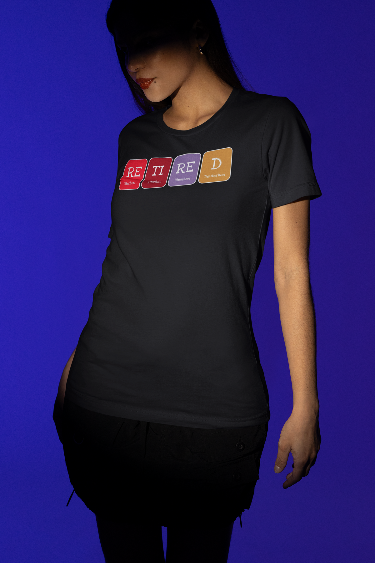 'Retired' periodic table t-shirt in navy blue, woman posing on a blue background, funny retirement gift