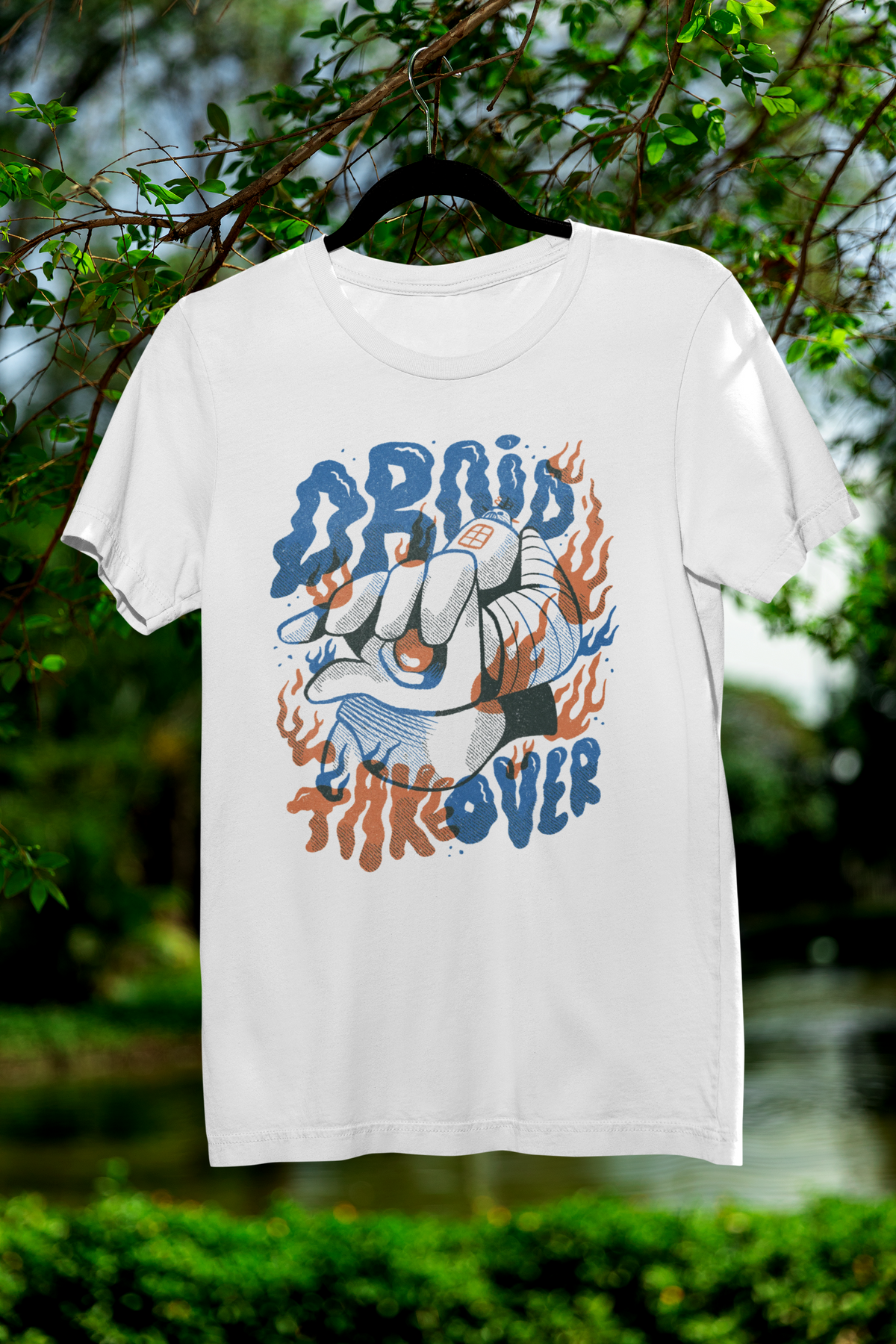 Droid Takes Over t-shirt in white, hanging outdoors in front of green trees
