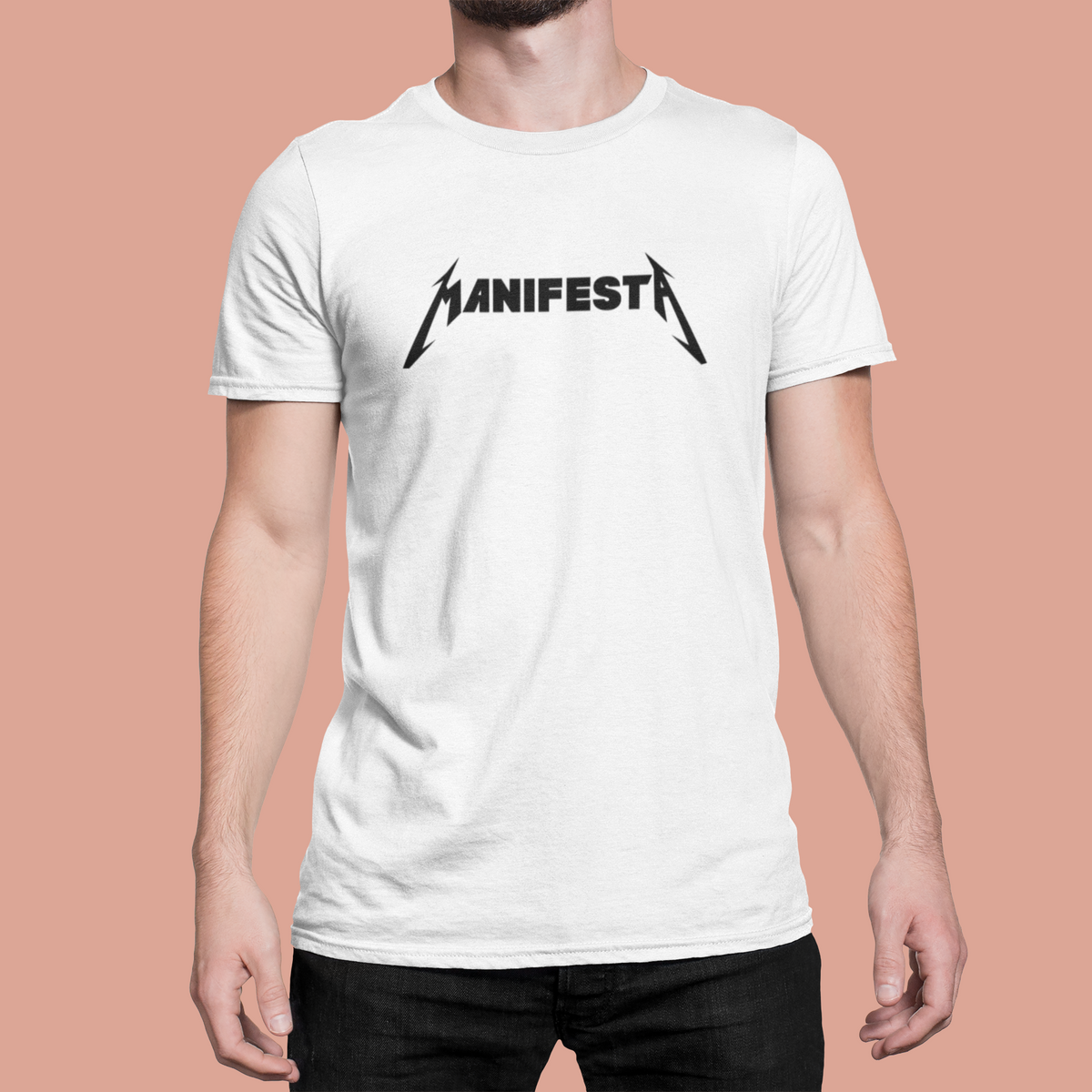 'Manifesta' organic t-shirt in white, man wearing it against pink background, unique statement tee
