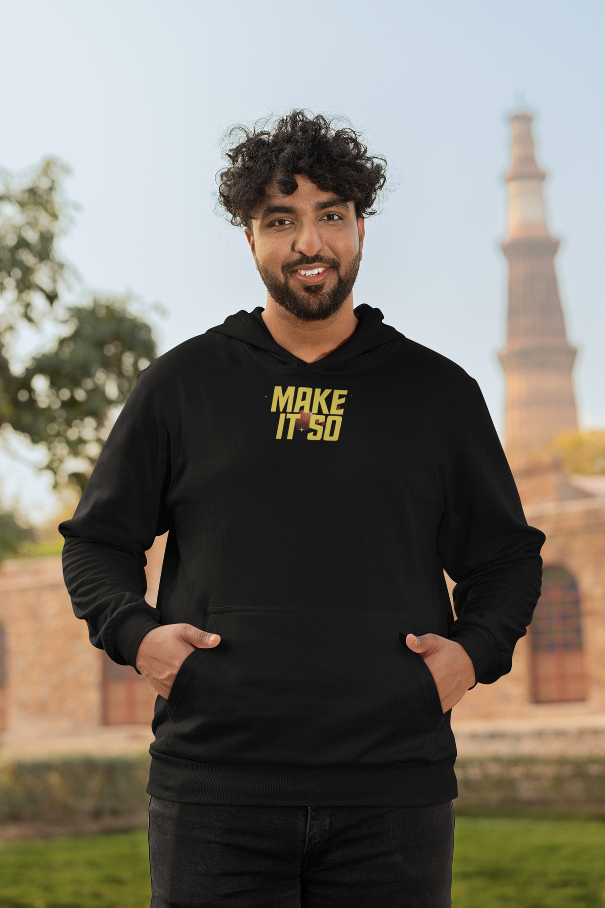 'Make It So Hoodie' in black, man by a historic building, Hoodie mockup, Geekpsters