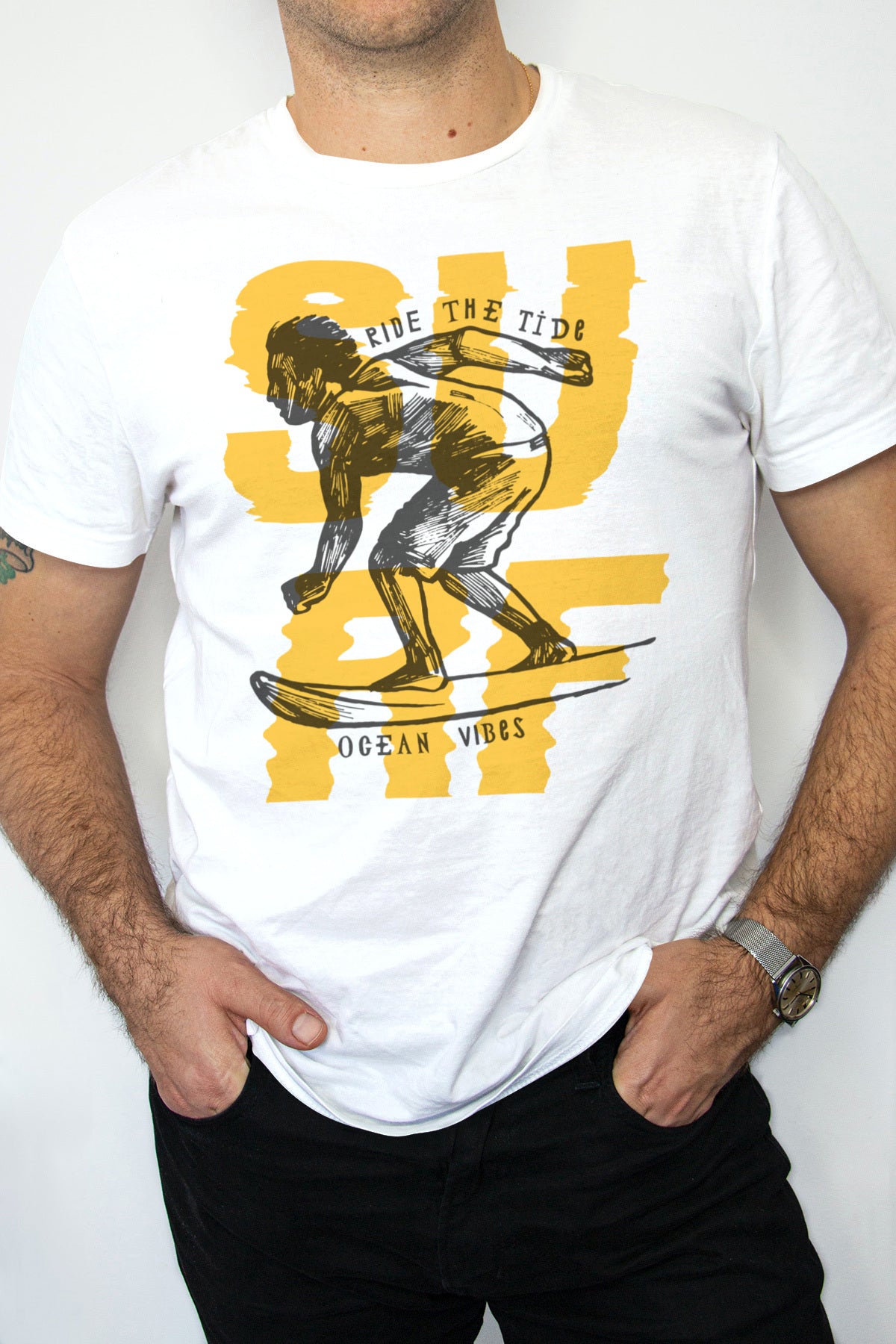 A man sporting an on-trend S U R F T-Shirt with a surfboard on it.